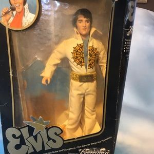 Elvis doll and magazines